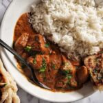 chicken tikka masala dish with simple homemade gluten free naan bread