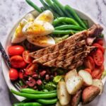 LOW FODMAP TWIST ON THE CLASSIC FRENCH NIÇOISE SALAD WITH EGG, POTATOES, OLIVES, GREEN BEANS AND TOMATOES