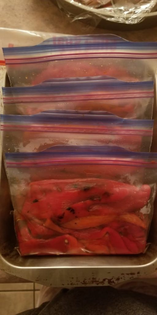 individual ziploc bags of freshly roasted red peppers, ready to freeze for later use