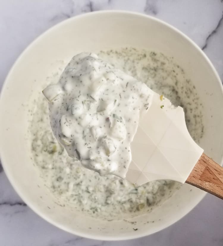 bowl of quick tartar sauce, some on a rubber spatula lifting it up