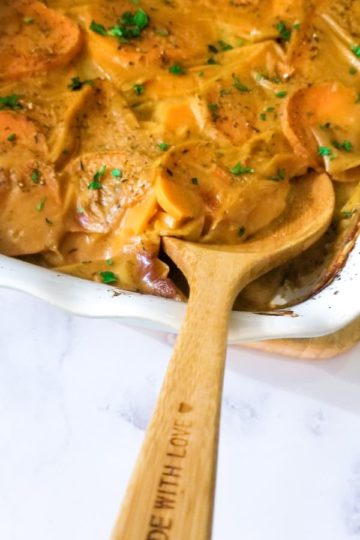 Thinly sliced sweet potatoes, vegetable broth and almond milk make up this great vegan side dish of scalloped sweet potatoes, topped with fresh chopped parsley