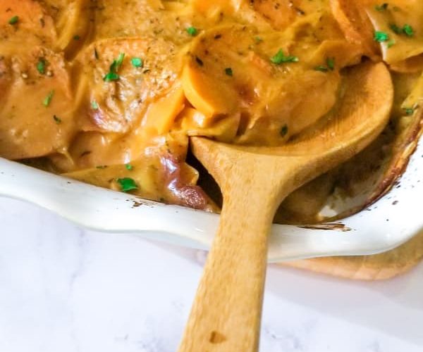 Thinly sliced sweet potatoes, vegetable broth and almond milk make up this great vegan side dish of scalloped sweet potatoes, topped with fresh chopped parsley