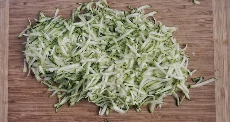 cutting board of shredded zucchini