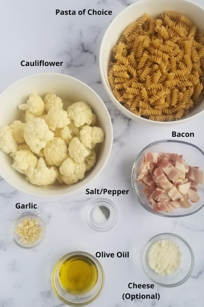 ingredients for pasta with cauliflower and bacon - cauliflower, bacon, pasta of choice, olive oil, parmesan cheese, salt and pepper, garlic