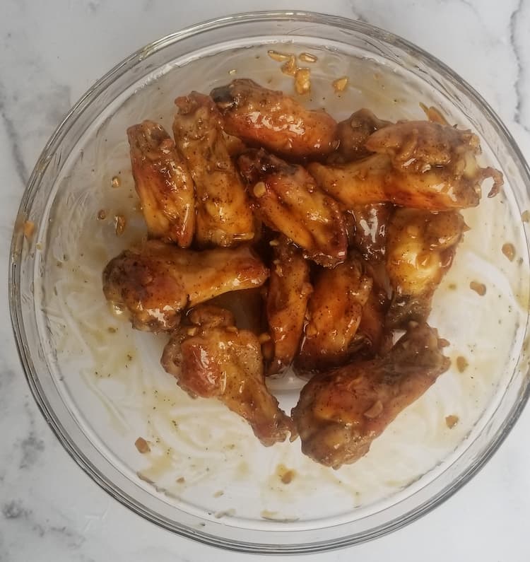 bowl of saucy chicken wings