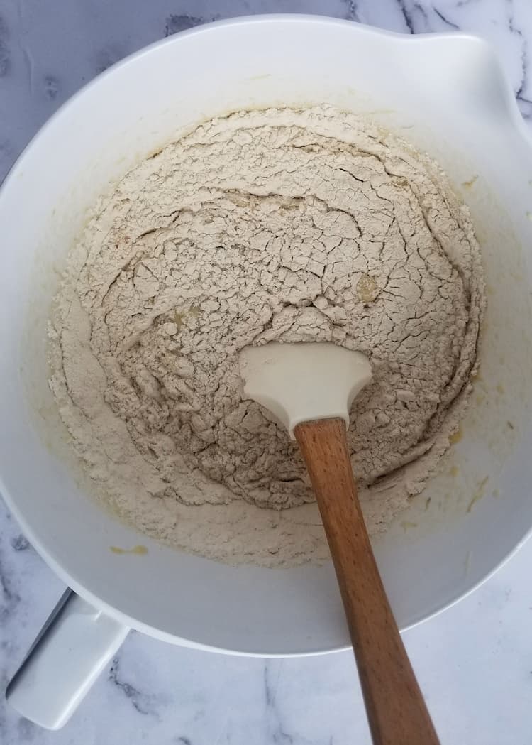 bow of flour with a rubber spatula in it
