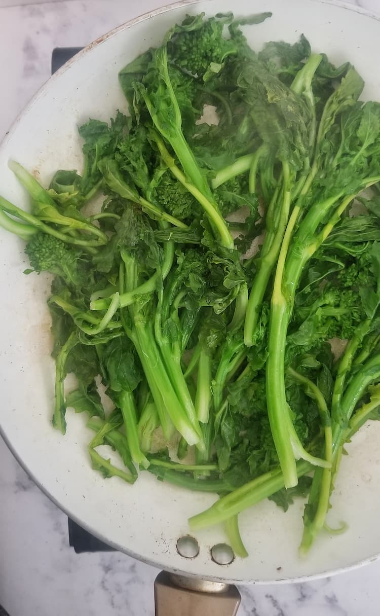 skillet with steamed rapini