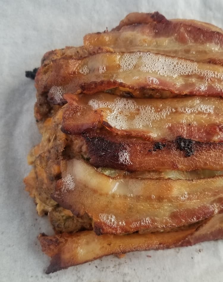crispy bacon strips over a meatloaf - side angle