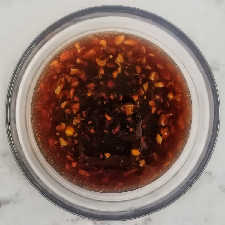 bowl of homemade honey garlic sauce with fresh minced garlic