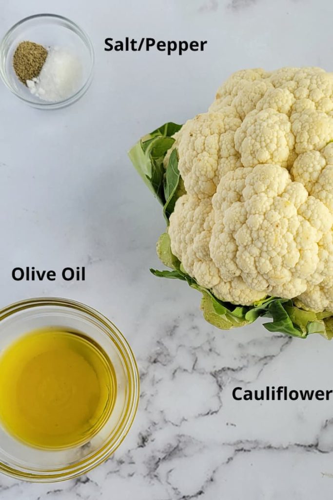 ingredients for roasted cauliflower in oven - cauliflower, olive oil and salt and pepper