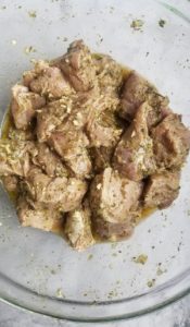 bowl of marinating pork chunks