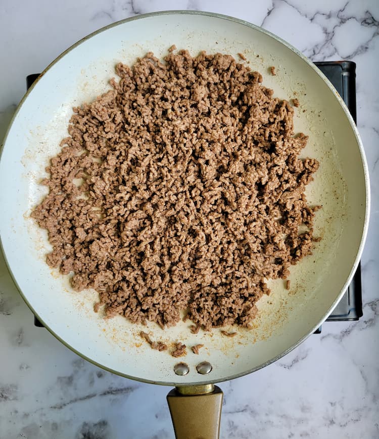 skillet with cooked ground beef
