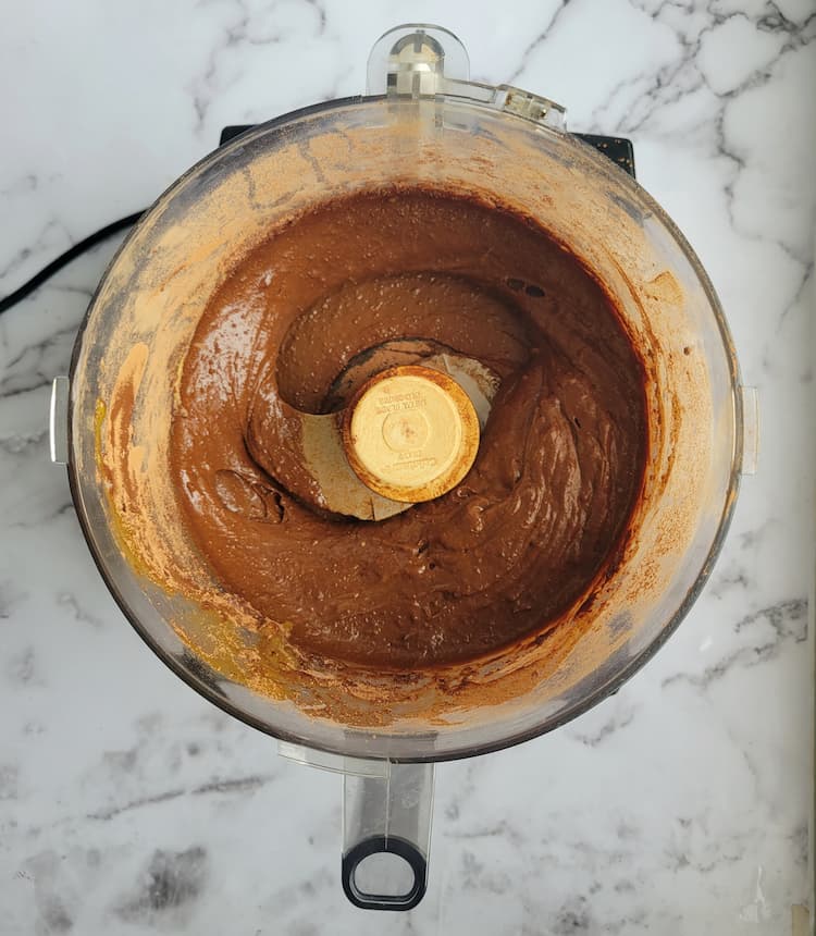 base of a food processor with a chocolate batter