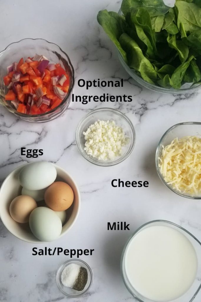ingredients for crustless quiche - optional veggies (red pepper and onions, spinach), cheese (crumbled goat and grated mozzarella), milk, salt/pepper, eggs