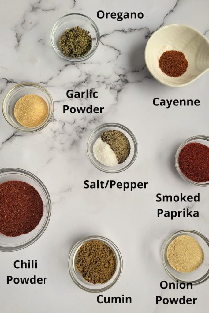 ingredients for homemade fajitas seasoning - salt, pepper, oregano, cayenne, smoked paprika, onion powder, cumin, chili powder, garlic powder