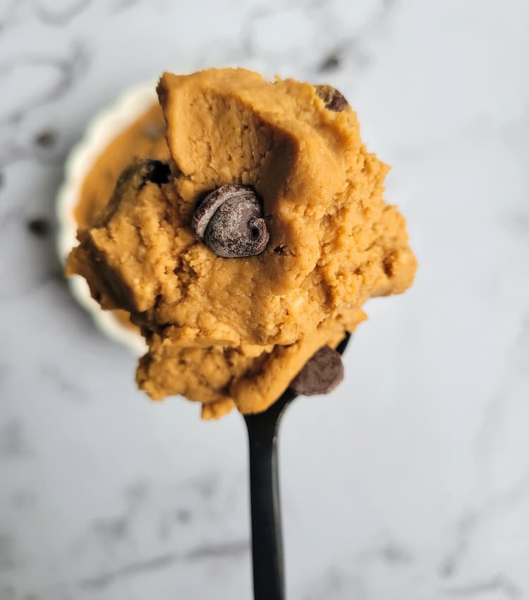spoonful of cookie dough with chickpeas and chocolate chips