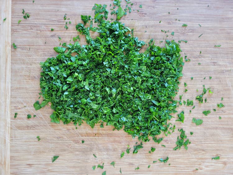 fresh chopped parsley on a cutting board