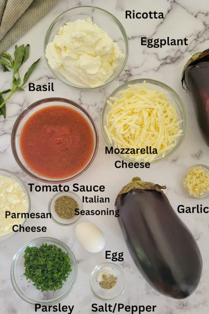 ingredients for recipe for eggplant rollatini - eggplants, egg, ricotta and parmesan cheese, basil, mozzarella, tomato sauce, italian seasoning, salt/pepper, parsley
