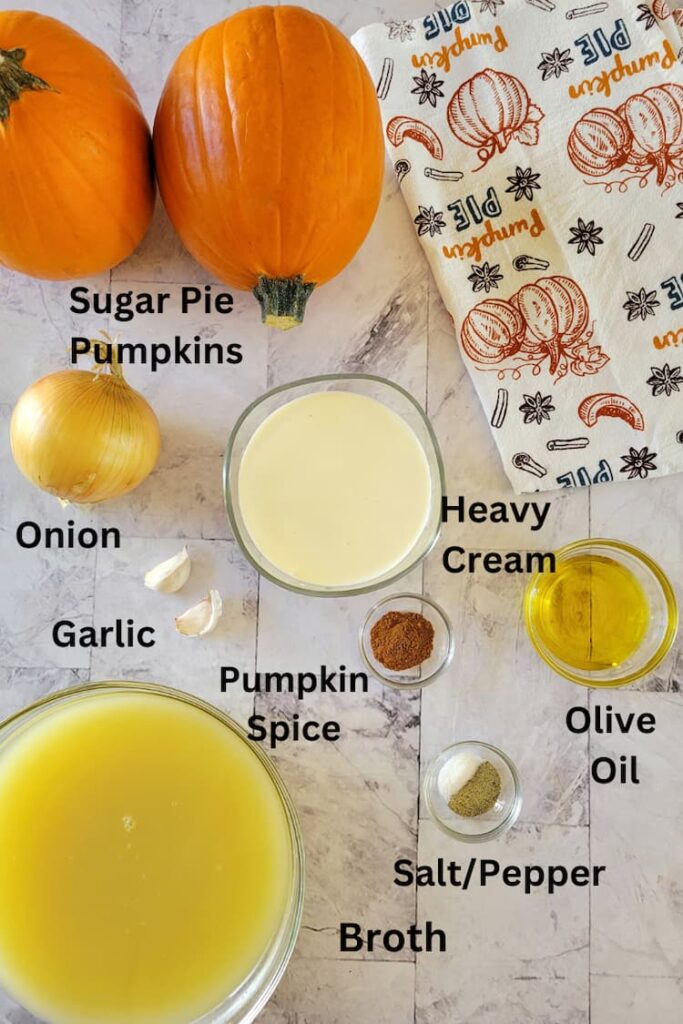 ingredients for recipe for pumpkin soup - sugar pie pumpkins, broth, garlic, onion, heavy cream, salt/pepper, olive oil, pumpkin spice