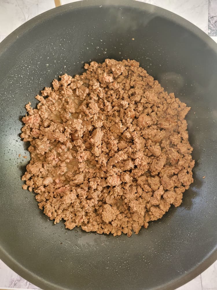 wok with cooked ground beef