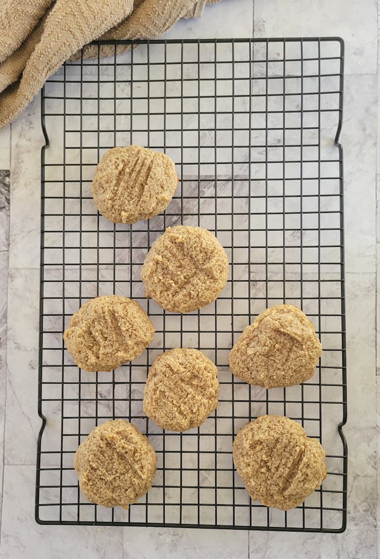 7 freshly baked almond flour cookies on a wire rack