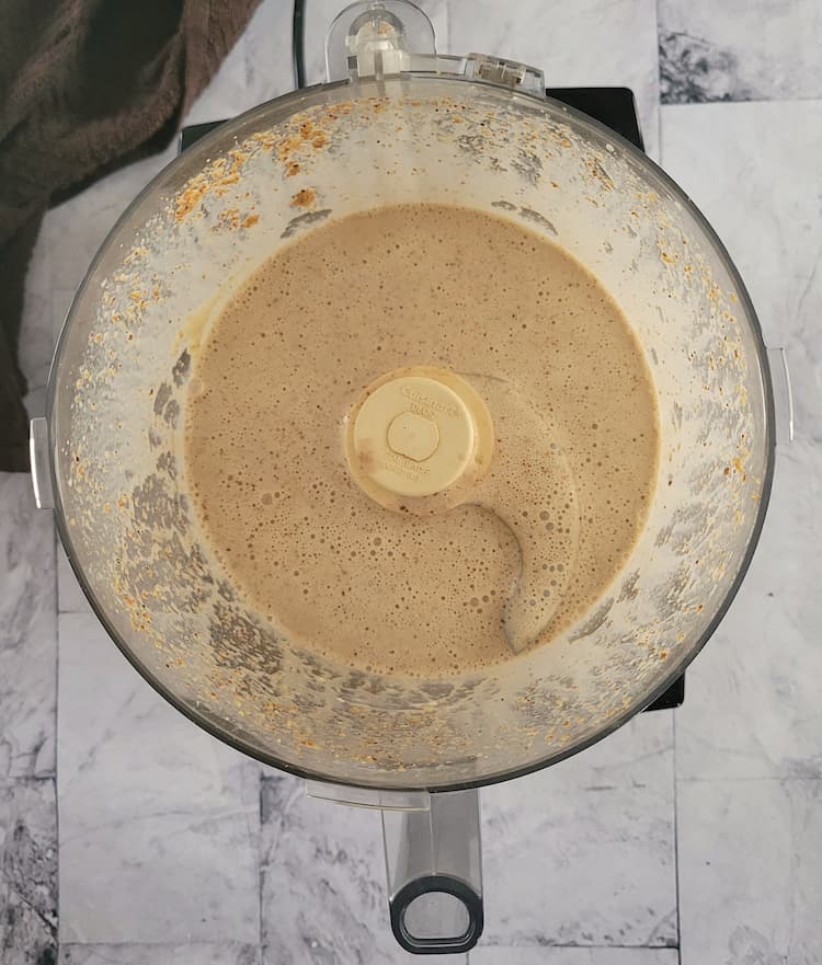 creamy white/yellow sauce in the base of a food processor