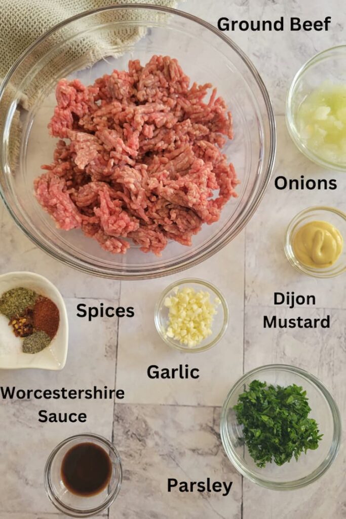 ingredients for gluten free meatballs - ground beef, spices, onion, parsley, garlic, worcestershire sauce, dijon mustard