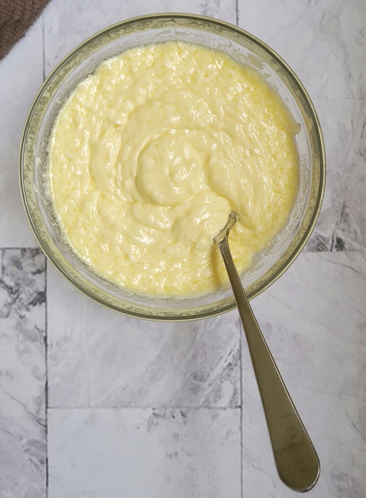thick creamy aioli in a bowl with a spoon