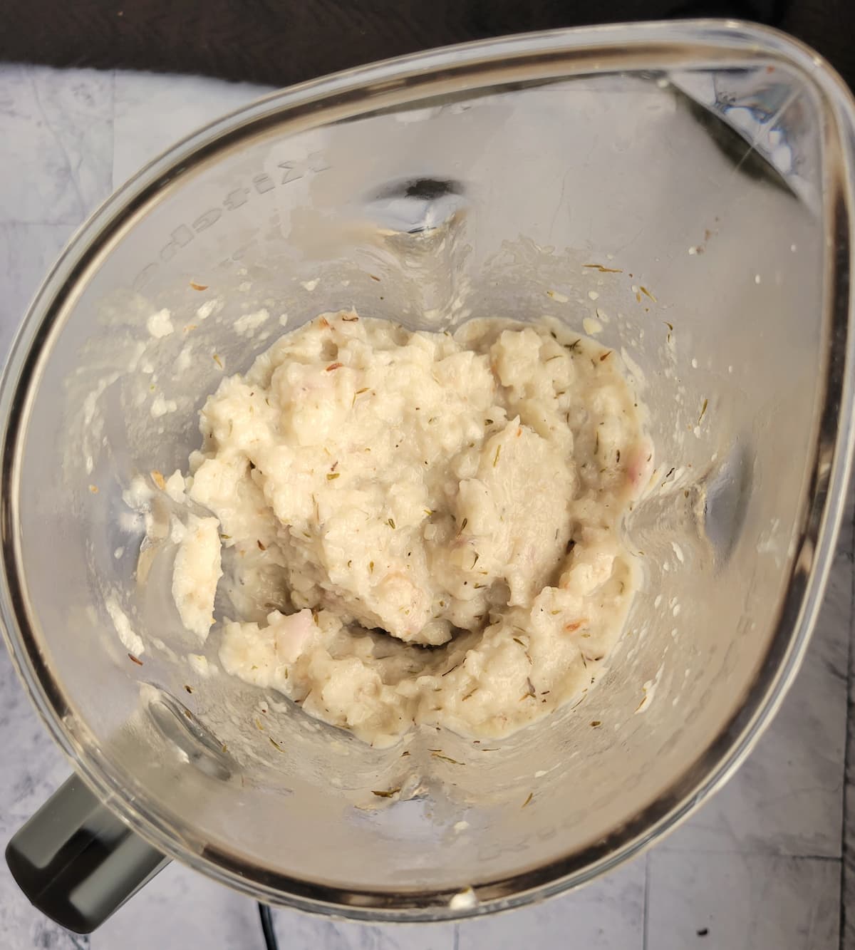 blender with creamy mashed seasoned turnips