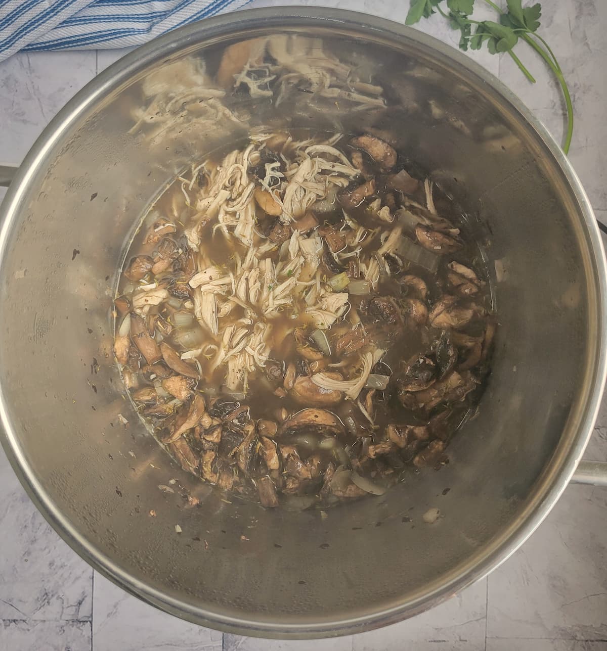 mushrooms, shredded chicken, broth and spices in a large pot