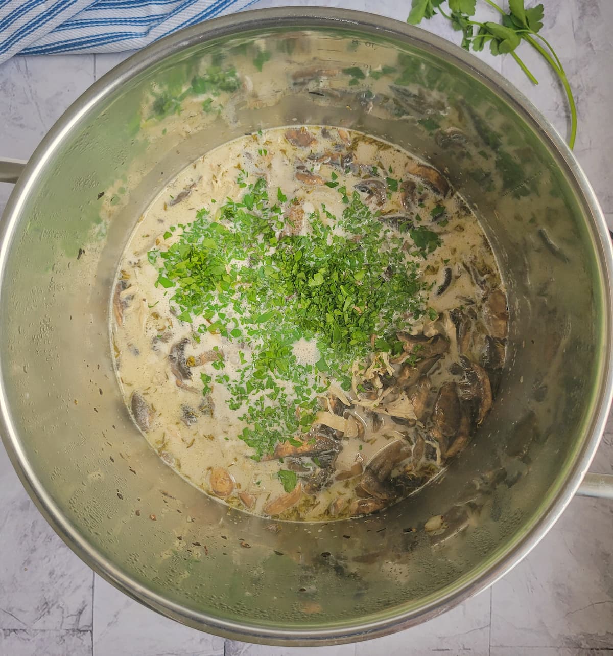 chopped parsley, heavy cream, sliced mushrooms and other ingredients in a large pot