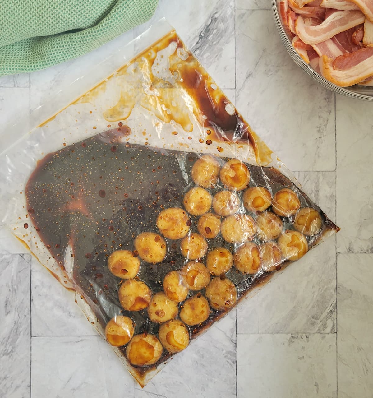 ziploc bag of water chestnuts marinating in soy sauce