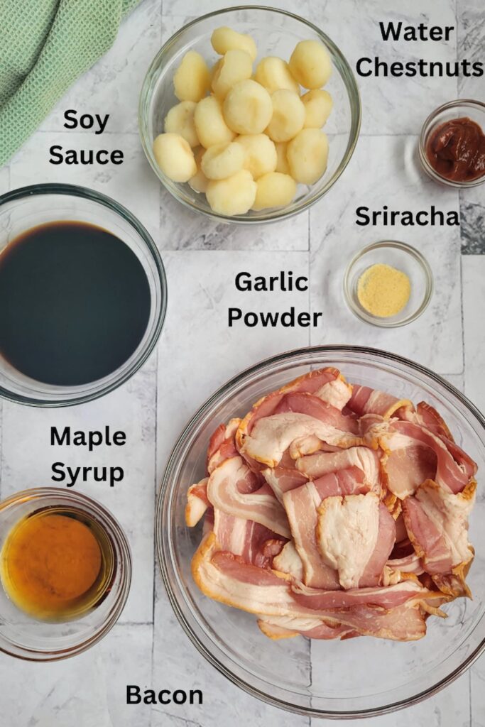 ingredients for bacon wrapped water chestnuts - water chestnuts, bacon, garlic powder, sriracha, soy sauce, maple syrup