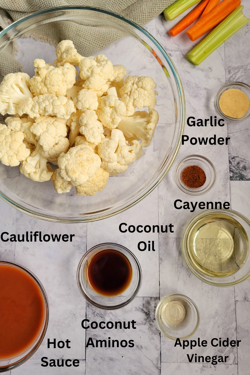 ingredients for cauliflower bites buffalo - cauliflower, garlic powder, cayenne, hot sauce, coconut oil, coconut aminos, apple cider vinegar