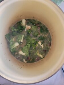 pot with bok choy in broth