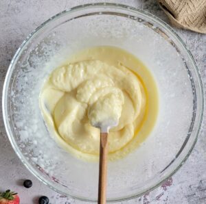 small rubber spatula in a bowl of instant vanilla pudding