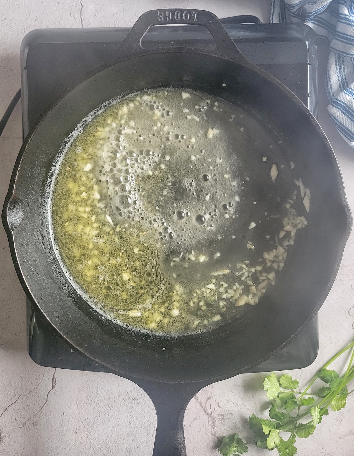 butter, oil and minced garlic in a cast iron skillet