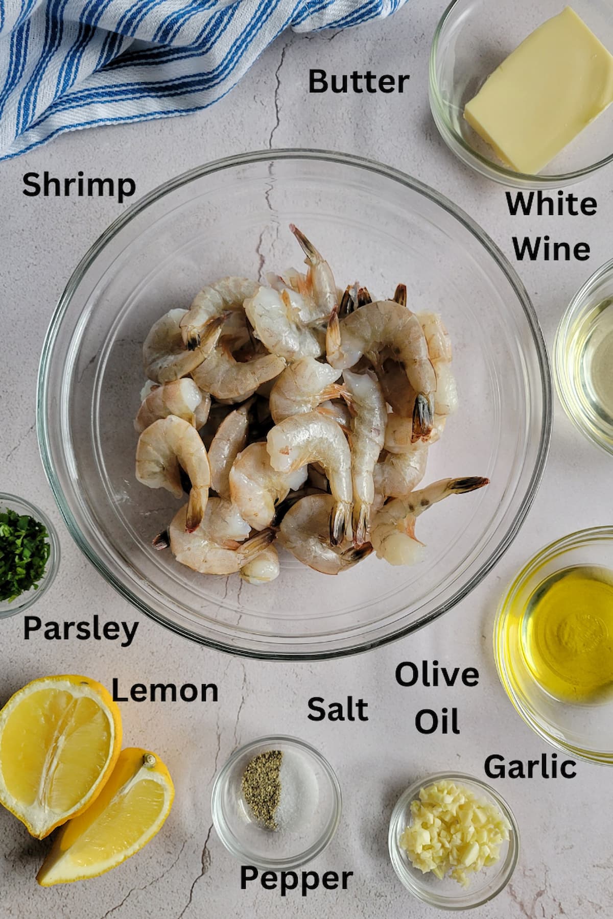 ingredients for sauteed shrimp - shrimp, butter, olive oil, white wine, salt/pepper, garlic, lemon, parsley