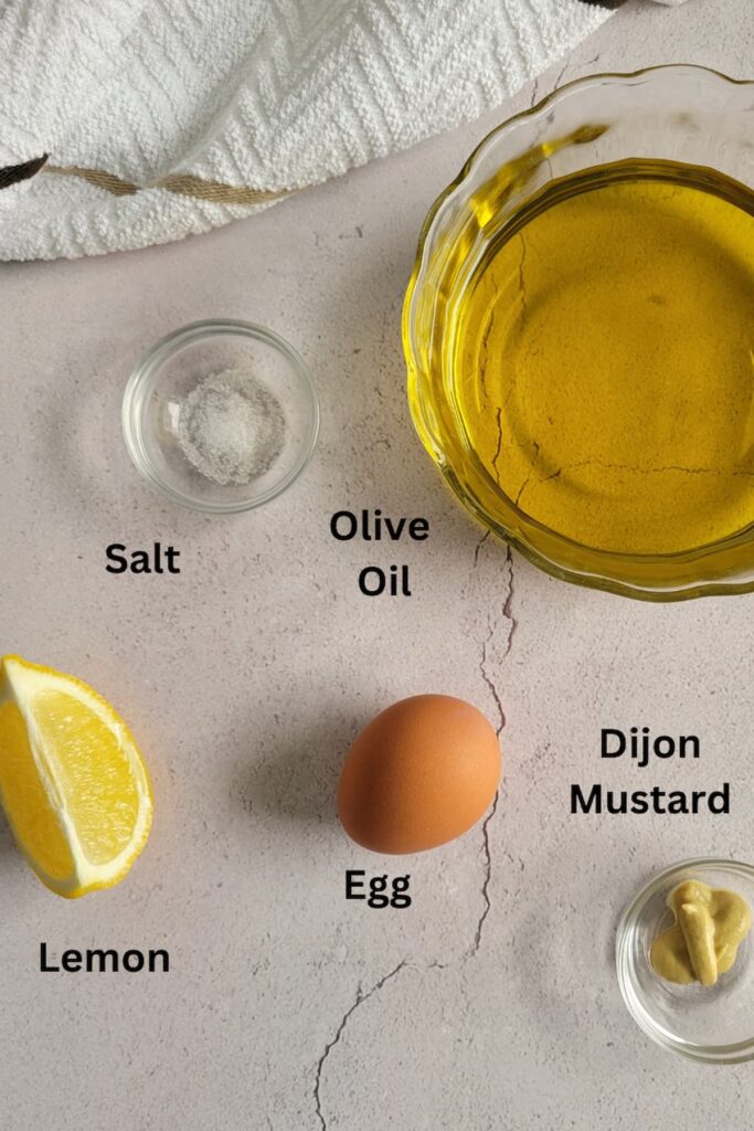 ingredients for mayo recipe - olive oil, egg, lemon, salt, dijon mustard