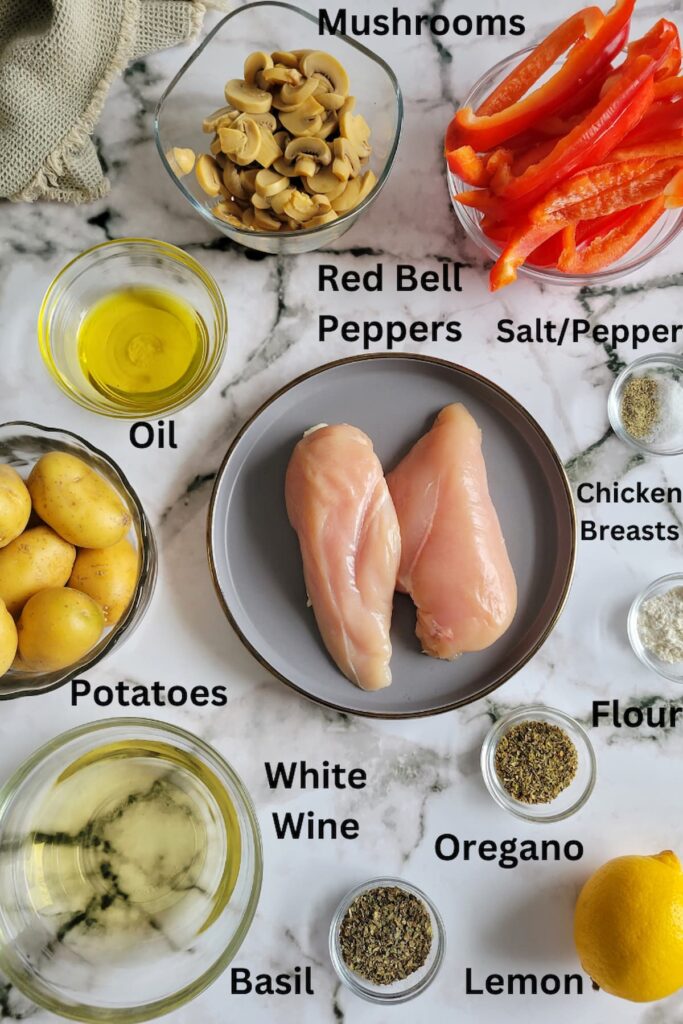ingredients for white wine chicken - chicken breasts, red bell peppers, mushrooms, oil, salt/pepper, basil, oregano, lemon, flour, potatoes, white wine