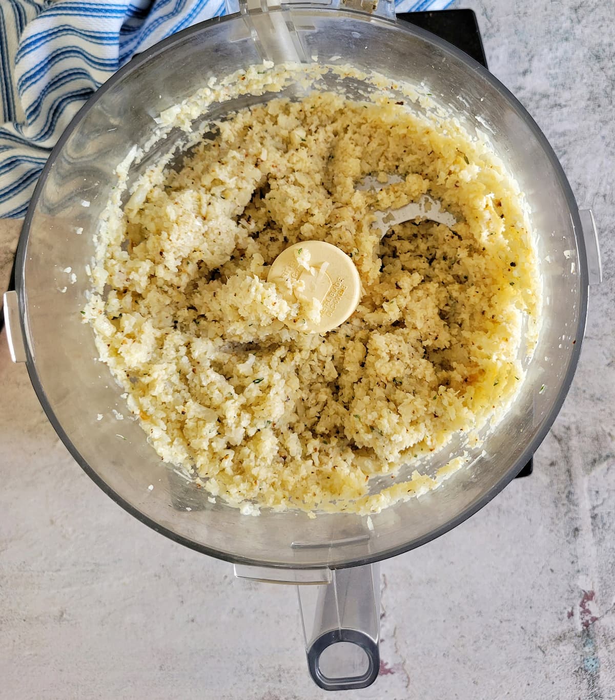 mashed cauliflower in the base of a food processor