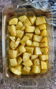 seasoned potato chunks in a casserole dish