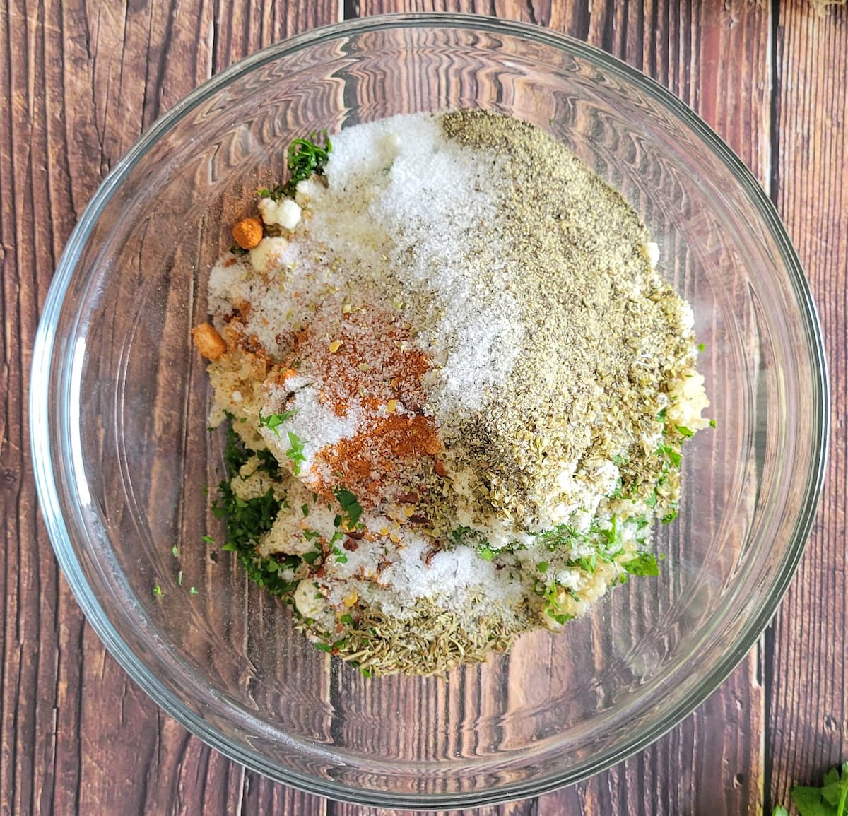 parmesan, salt, pepper, spices and other ingredients in a bowl
