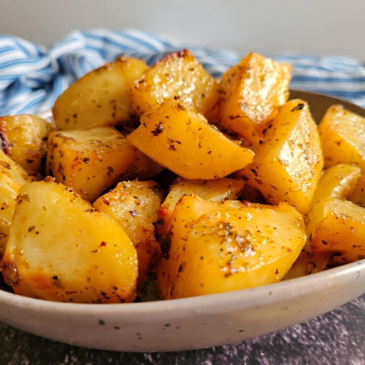 roasted and seasoned potatoes piled into a bowl