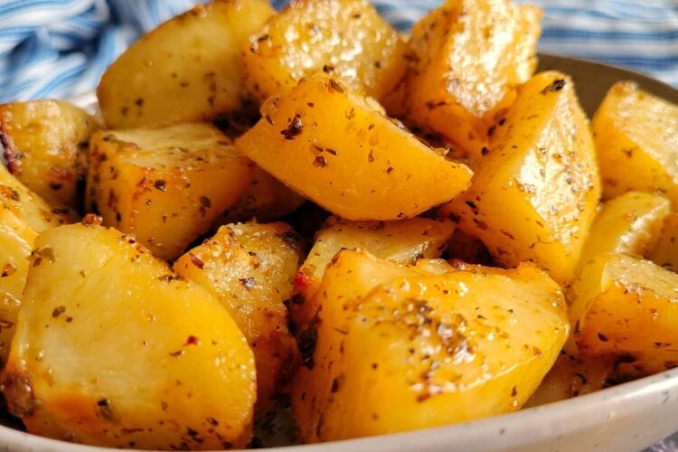 roasted and seasoned potatoes piled into a bowl
