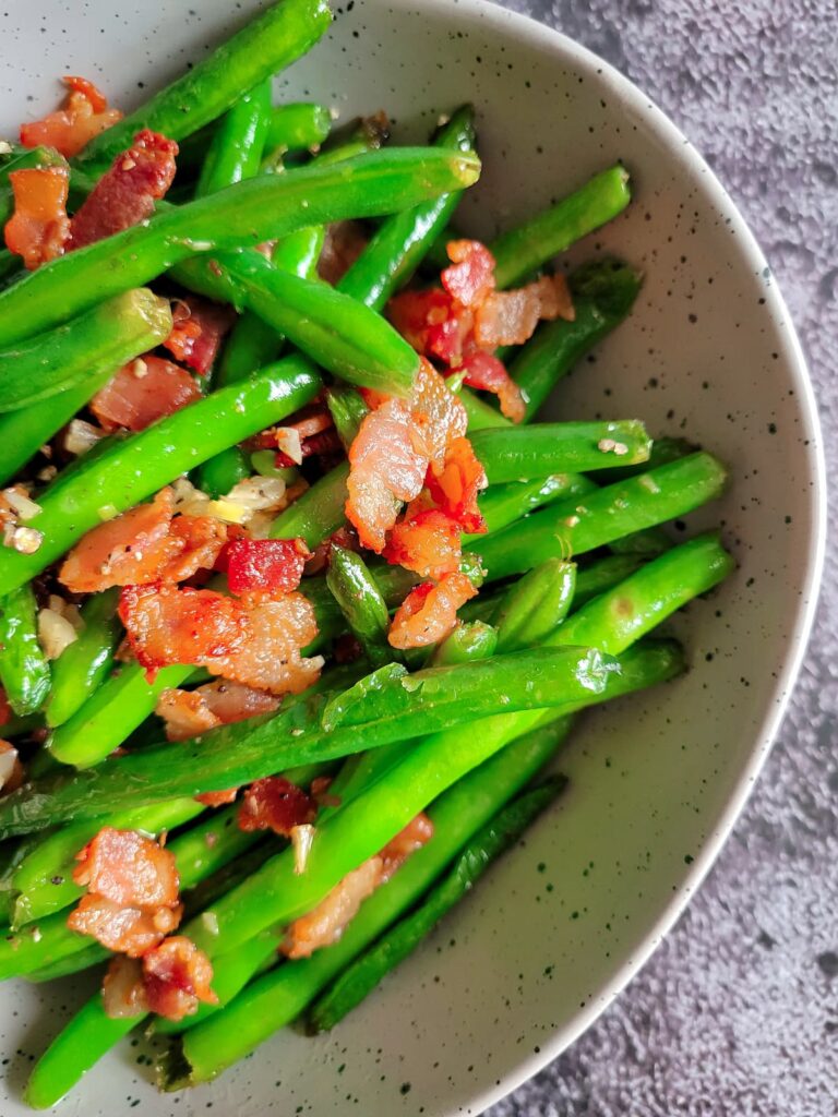 bowl of green beans, bacon and garlic