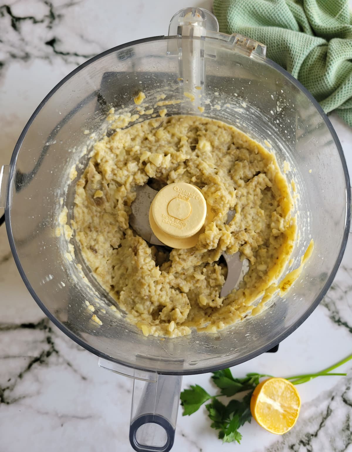 blended eggplant dip in the base of a food processor