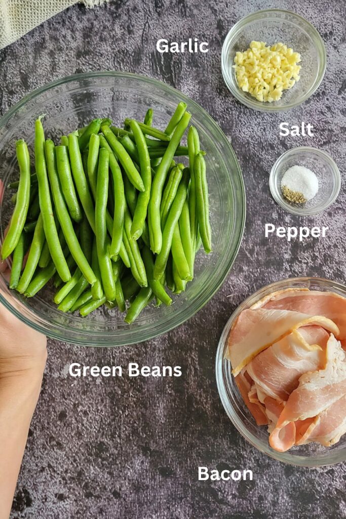 ingredients for bacon with green beans - green beans, bacon, salt, pepper, garlic