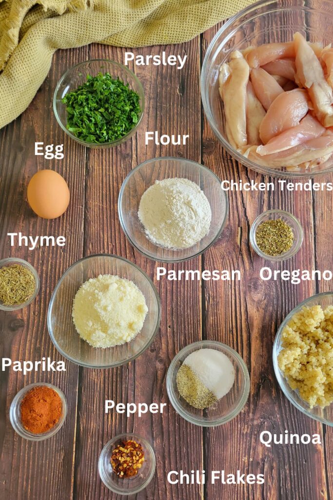 ingredients for quinoa chicken tenders - chicken tenders, parsley, flor, eggs, thyme, oregano, parmesan, chili flakes, quinoa, paprika, pepper, salt