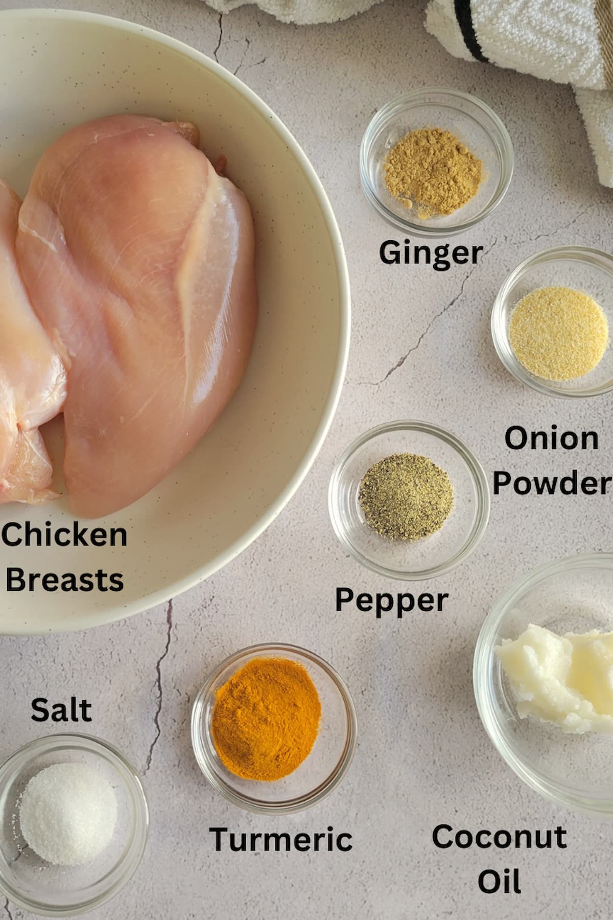 ingredients for recipe for turmeric chicken - chicken breasts, turmeric, pepper, salt, onion powder, ginger, coconut oil